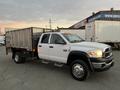 A 2008 Dodge Ram 5500 with a flatbed truck design featuring a silver metal cargo area and a white cab with visible headlights and markers on the roof