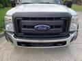 Front view of a 2012 Ford F-550 truck showing the grille with the Ford emblem and the "SUPER DUTY" label