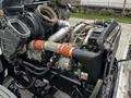 A 2014 Kenworth T370 engine showcasing exposed components including a turbocharger and various hoses and pipelines
