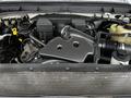 The engine compartment of a 2011 Ford F-250 SD showing the air intake system and various engine components