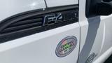 White 2011 Ford F-450 Super Duty with a certification sticker labeled certified clean idle on the side