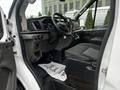 Interior of a 2021 Ford Transit showing driver seat dashboard with steering wheel and control panel