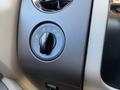 A dial for controlling headlights and fog lights in a 2013 Ford Expedition interior