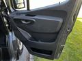 Interior door panel of a 2021 Mercedes-Benz Sprinter featuring a handle and built-in storage compartment