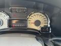 Dashboard of a 2013 Ford Expedition showing speedometer and gear indicator with various gauges for fuel and other indicators