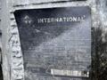 A metal plate displaying important engine information for a 2006 International 7500 truck including model year and engine specifications