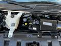 The image shows the engine compartment of a 2017 Chevrolet Express highlighting the radiator reservoir and various engine components