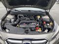 A 2019 Subaru Outback with its hood open displaying the engine compartment featuring various components such as the engine, battery, and fluid reservoirs