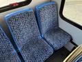 Two blue and patterned fabric seats in a Chevrolet Express van interior