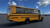 2014 Freightliner Thomas diesel school bus with a yellow exterior and black accents parked on a lot