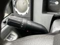 Close-up of the turn signal and light control stalk on a steering wheel of a 2014 Ford F-550