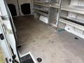 2019 Mercedes-Benz Sprinter van interior with empty cargo space and metal shelving units along the sides