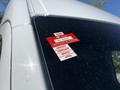 A 2022 Mercedes-Benz Sprinter with a red certificate of approval sticker attached to the side window