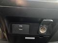 A USB port and a 12V power outlet in the console of a 2017 Ford F-150