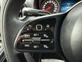 Close-up of the steering wheel controls in a 2019 Mercedes-Benz Sprinter featuring buttons for cruise control and vehicle settings