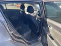 Interior of a 2012 Kia Sportage showing rear seats and front dashboard with steering wheel visible