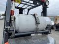 2011 Toyota Forklift with a large propane tank secured on the back and visible safety features including a fire extinguisher mounted on the side