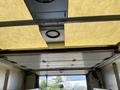 Interior view of a 2012 Ford Econoline with a focus on the ceiling and lighting features