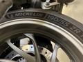 Close-up of a Michelin motorcycle tire with the size 190/55 ZR 17 prominently displayed on a 2013 BMW K1600GTL wheel