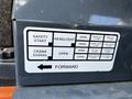 Control panel of a 2017 Gehl R105 showing various operational labels including safety start headlight crank signal and a forward direction indicator