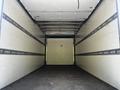 An empty interior of a 2020 Hino 195 truck with plain walls and a flat floor