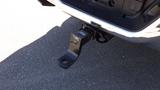 A black tow hitch attached to the rear of a 2014 RAM 3500 truck