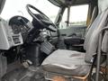 Interior view of a 2007 International 4300 truck showing the driver's seat steering wheel and dashboard with gauges and controls