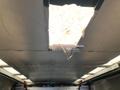 Interior view of a 2005 Freightliner MT45 Chassis with a light fixture and a partially exposed ceiling panel