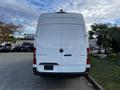 A 2022 Mercedes-Benz Sprinter van viewed from the rear with a white exterior and the model name displayed on the back