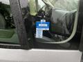 A 2018 RAM Promaster with a sticker indicating a certificate of approval for the year 2025 showing months from January to July on the driver's side window