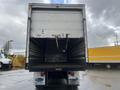 Rear view of a 2008 Hino 268 truck with an empty cargo area and a sliding door mechanism visible