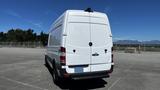 A white 2016 Mercedes-Benz Sprinter van viewed from the rear with a high roof and large cargo area