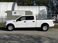 2017 Ford F-150 pickup truck in white with a spacious crew cab and a white truck bed attached