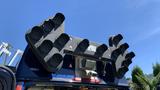 A 2013 Ford Econoline van equipped with a large array of black lighting fixtures attached to the roof