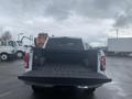 A 2017 Ford F-150 with an open truck bed showing a black bed liner