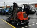 A 2020 Jacobsen HR800 turf mower with raised cutting decks showcasing its large mower blades and orange exterior design