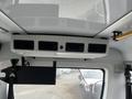 Interior view of a 2017 Chevrolet Express showing the ceiling vents and control panel above the front seats