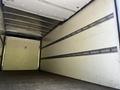 A 2020 Hino 195 box truck interior featuring a spacious cargo area with metal strip reinforcements along the walls and a wooden floor