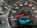 Dashboard of a 2018 Chevrolet Express displaying speedometer fuel gauge and engine hour meter with the needle pointing to 0 mph and the engine hours reading 16115.1