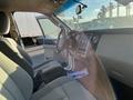 Interior view of a 2013 Ford Expedition showing the driver's seat steering wheel and dashboard with controls and displays