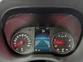 The dashboard of a 2019 Mercedes-Benz Sprinter displaying speedometer and navigation screen with indicators