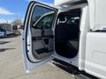 A 2019 Ford F-350 SD with an open front door revealing the interior seating and dashboard area