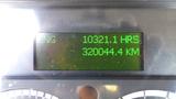 Digital display showing engine hours as 10321.1 and a mileage of 320044.4 kilometers on a 2017 Freightliner M2 106.