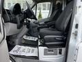 2017 Mercedes-Benz Sprinter front cabin featuring two black bucket seats and a dashboard with controls and a steering wheel