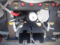 A 2007 Ford F-650 with visible hydraulic connections and air tool attachments in a close-up view