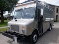 A silver 2007 Morgan Olson Workhorse W42 delivery truck with a flat front, side mirrors, and multiple pipes on the roof