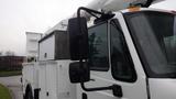 A white 2005 International 4300 utility truck with a bucket lift attachment and large side mirrors