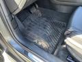 Interior view of a 2016 Audi A3 showing a dirty black rubber floor mat with the A3 logo in the front driver's area