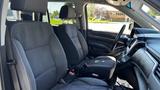 Interior of a 2018 Chevrolet Tahoe showcasing two front seats with fabric upholstery and a black dashboard