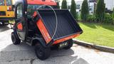 A 2018 Kubota RTV X1100C side-by-side utility vehicle with an orange and black exterior features a raised dump bed at the rear